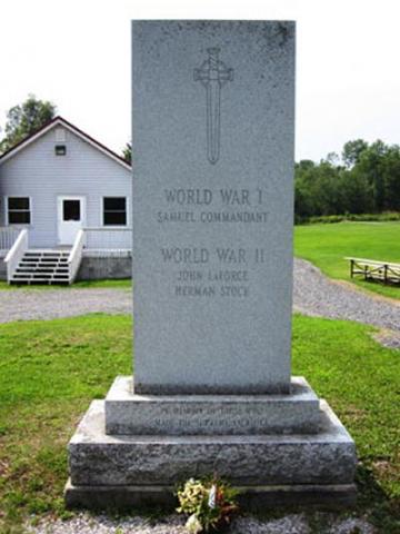 Monument – A granite stele at lot 12, Concession 6, Muskoka Road 38, Wahta Mohawk Reserve, ON was erected by elders of the Wahta Mohawk Reserve. This memorial is dedicated to the local war dead of the First and Second World Wars